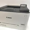 A close-up, slightly angled view of a white Canon laser printer. Produktbild-Vorschau