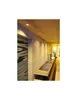A modern bathroom or spa area with wooden walls and ceiling, featuring a sleek counter with a sink and a metallic dispenser. Produktbild-Vorschau