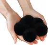 Hands holding black filter balls. Voir les images du produit