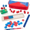 A collection of math manipulatives including dice, cubes, counters, an abacus, and a pencil case. Podgląd zdjęcia produktu