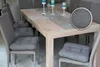 A dining table with chairs and seat cushions. Produktbild-Vorschau