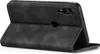 A black flip cover case for a smartphone is shown from the back, with the cover open. Produktbild-Vorschau