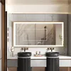 A modern bathroom vanity with a large LED mirror, two sinks, and faucets. Náhled obrázku produktu