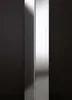 A close-up, studio shot of a shower enclosure corner, highlighting its reflective surface and clean lines against a dark background. Produktbild-Vorschau