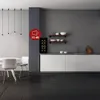 A modern kitchen or dining area with a wine cooler, cabinets, and a table with chairs. Produktbild-Vorschau