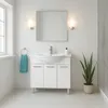 A clean and modern bathroom vanity with a sink, mirror, and towel. Produktbild-Vorschau