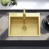 A top-down view of a gold sink with a gold faucet on a marble countertop. Podgląd zdjęcia produktu
