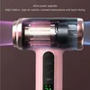 Close-up of a pink and rose gold hairdryer with a transparent casing showing internal components, with marketing text overlay. Podgląd zdjęcia produktu