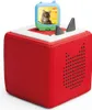 A red cube-shaped toy with a small blue and green toy on top, featuring a cat image. Náhled obrázku produktu