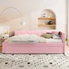 A pink daybed is set up in a bedroom with a decorative arched shelf on the wall. Podgląd zdjęcia produktu