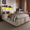 A bedroom scene featuring a bed with integrated lighting and storage. Produktbild-Vorschau