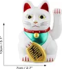 A white Maneki-neko cat figurine with a red collar and green bib, holding a gold coin. Produktbild-Vorschau