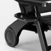 A close-up view of the wheel and a small tray attached to a black plastic chair. Produktbild-Vorschau