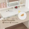 A close-up view of a white vanity table with makeup brushes, bottles, and a small spill highlighted in a circular inset. Text overlays indicate product features. Produktbild-Vorschau