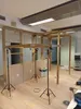 A construction or renovation scene inside an office or commercial space, with wooden structures and support poles. Produktbild-Vorschau