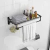 A bathroom shelf with towels and toiletries mounted on a tiled wall. Náhľad obrázku produktu