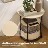 A three-tiered side table with a storage basket, placed in a room with wooden flooring and a wall with shadows. Produktbild-Vorschau