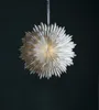 A white paper star ornament hangs against a dark green background. Podgląd zdjęcia produktu