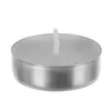 A single tea light candle in a silver metal holder with a white wick, isolated on a white background. Podgląd zdjęcia produktu