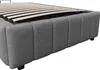 A close-up view of a grey upholstered bed frame with a slatted base. Voir les images du produit