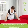 A hotel maid making a bed with red sheets. Produktbild-Vorschau