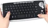 Hands operating a wireless keyboard with a trackball mouse. Produktbild-Vorschau