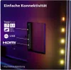 Close-up of the back of a TV showing connectivity ports and LED lighting. Produktbild-Vorschau