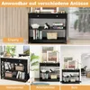 A collage of images showing a black console table in different settings: an entryway, a living room, and an office. The table has a drawer and two shelves, and is decorated with books, baskets, and decorative items. Produktbild-Vorschau
