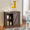 A dark brown buffet cabinet with a sliding barn door, placed in a room with a white chair and a painting on the wall. Podgląd zdjęcia produktu