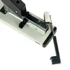 A close-up view of a stapler mechanism, showing the internal workings and a detached staple guide. Náhľad obrázku produktu