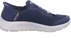 A side view of a blue Skechers slip-on sneaker with a white sole. Anteprima dell’immagine prodotto