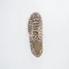 A top-down view of a single leopard-print sneaker on a white background. Voir les images du produit