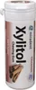A white cylindrical container of chewing gum with cinnamon sticks depicted on it. Produktbild-Vorschau