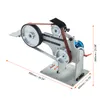 A belt grinder machine is shown from a diagonal angle against a white background. Dimensions are indicated with orange lines and text. Produktbild-Vorschau