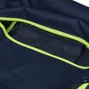 A close-up view of a navy blue bag with a neon yellow zipper and a small gray zippered pocket inside. Náhľad obrázku produktu