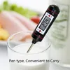 A digital thermometer is shown in a glass of milk with food in the background. Produktbild-Vorschau