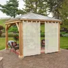 A gazebo with curtains set up on a patio in a garden. Produktbild-Vorschau