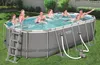 A family is enjoying a swim in an oval above-ground pool set up in a backyard. Anteprima dell’immagine prodotto