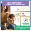 A mother and child are sitting by a window, looking at window decorations. The image highlights safety certifications and non-toxic paint. Produktbild-Vorschau