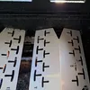 Close-up view of metal heat shields inside a grill. Produktbild-Vorschau