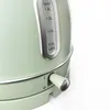 A close-up shot of a green electric kettle, focusing on the water level indicator and the power switch. Produktbild-Vorschau
