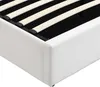 Close-up view of the corner of a white upholstered bed frame with wooden slats visible inside. Náhľad obrázku produktu