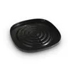 A black circular grill plate with concentric circular ridges and small holes around the edge. Anteprima dell’immagine prodotto