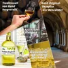 A collage of images showcasing a bottle of Maikäferflugbenzin liqueur, a glass of the liqueur, and descriptive text about its production and taste, set against various backgrounds. Produktbild-Vorschau