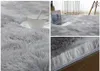 Collage of images showing a fluffy gray rug in different close-up and wider shots, with a cup and saucer and a laptop on it. Produktbild-Vorschau