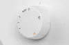 A close-up of a white rotary dial on a sewing machine. Produktbild-Vorschau