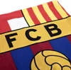 A close-up view of a FC Barcelona branded blanket or scarf. Produktbild-Vorschau