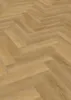 A close-up, angled view of a wooden floor with a herringbone pattern. Produktbild-Vorschau