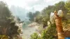 A lush jungle scene with a river and a primitive axe in the foreground. Produktbild-Vorschau