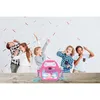 Children singing and dancing around a karaoke machine. Produktbild-Vorschau